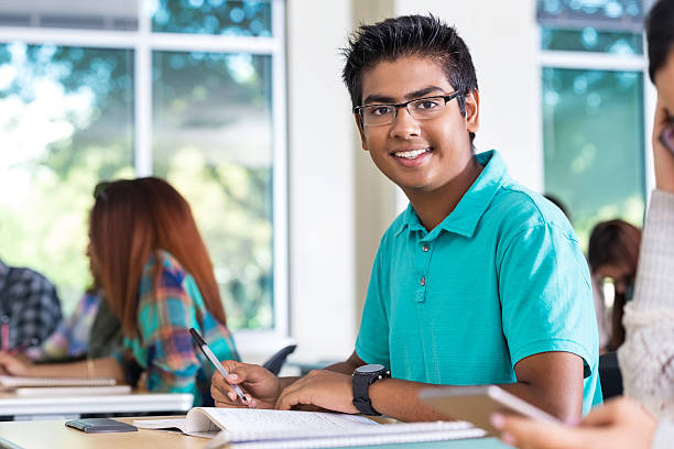 Indian student taking exam in high school or college class