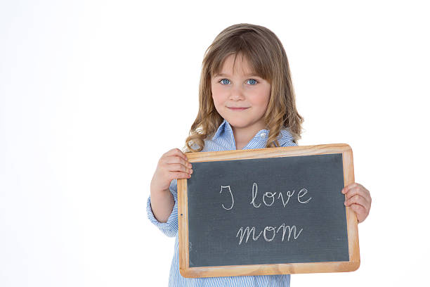 istock portrait of nice child holding blackboard 523377385