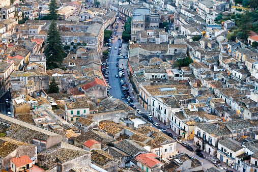 Panorama from above of Modica, Sicily (Italy). Modica is a UNESCO World Heritage Site in Southeast Sicily. The main street visible here is Corso Umberto.