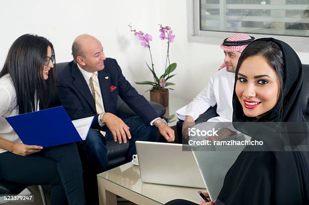 Arabian Businesswoman With Businesspeople Meeting In The Background Stock Photo - Download Image Now