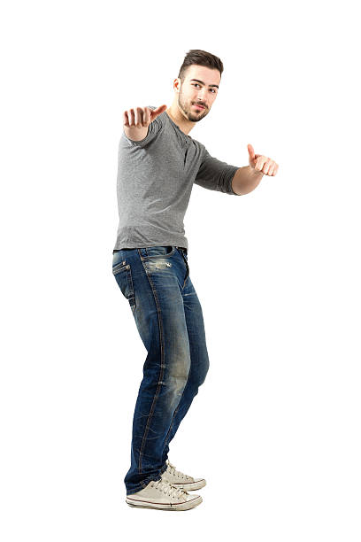 istock Happy confident young man with thumbs up gesture 523380223
