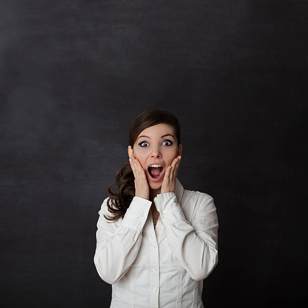 istock Woman screaming blackboard 523381601