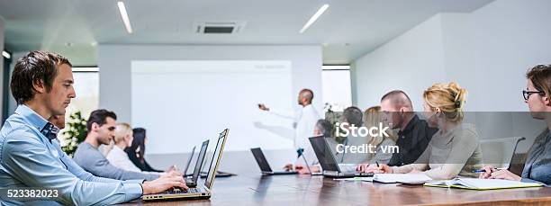Executive Explaining Something In A Board Room Stock Photo - Download Image Now - Meeting, Business, Conference - Event