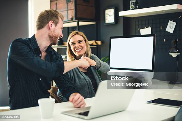 We Did It Stock Photo - Download Image Now - Fist Bump, High-Five, Office