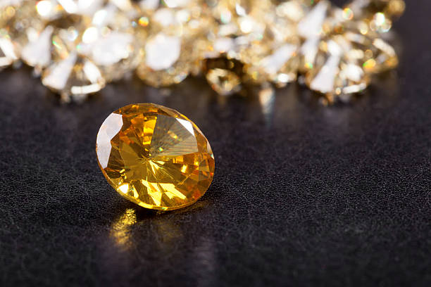 istock Citrine stone on black bacground 523384329