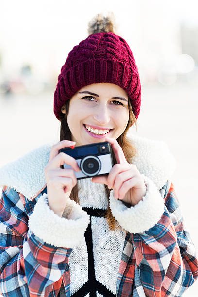 istock Young woman with vintage camera 523384927