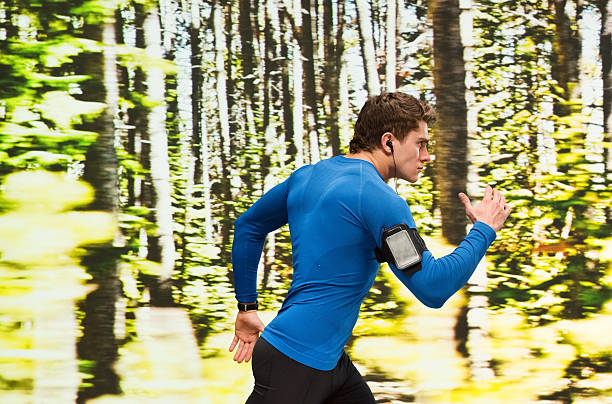 istock Male runner running outdoors 523386536
