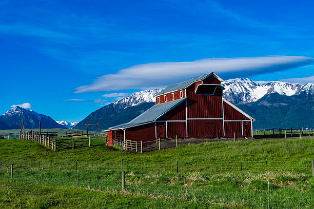 istock Red barn near Mountains in Eastern Oregon 523386888
