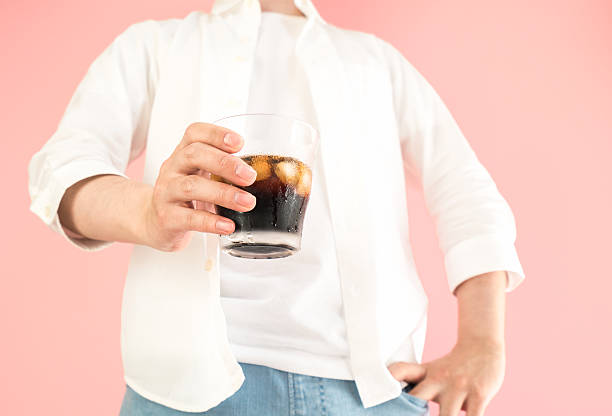 istock Asian man holding a grass of iced coffee 523386964