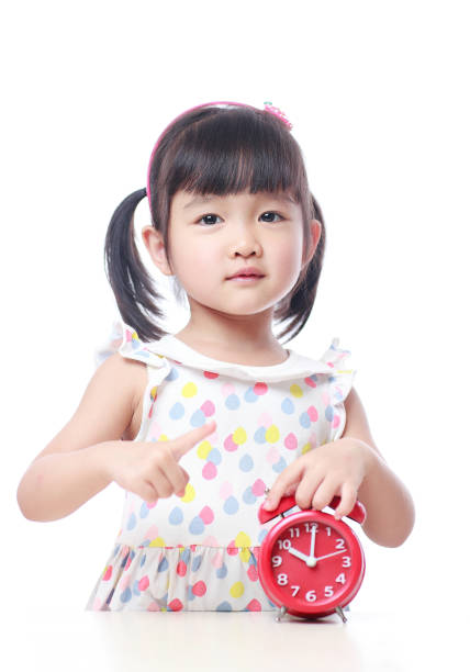 istock Children and red alarm clock 523388268
