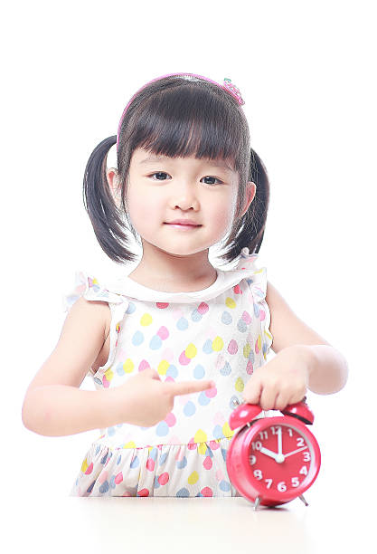 istock Children and red alarm clock 523388368