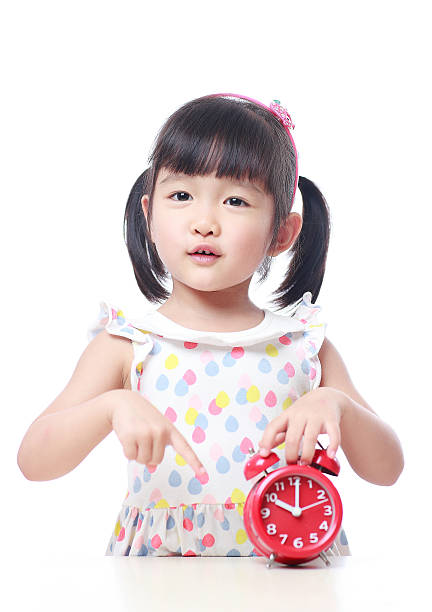 istock Children and red alarm clock 523388406