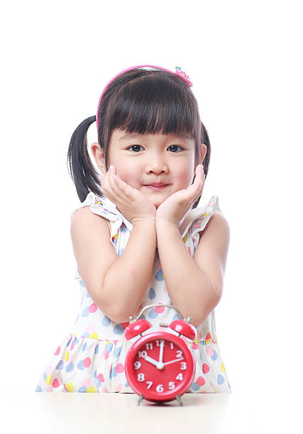 istock Children and red alarm clock 523388422