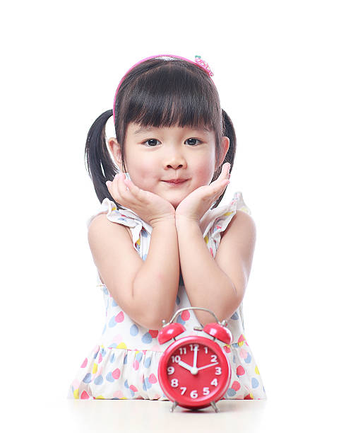 istock Children and red alarm clock 523388478