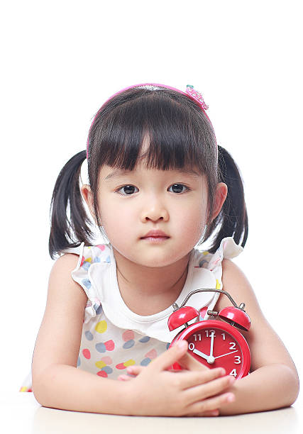 istock Children and red alarm clock 523388512