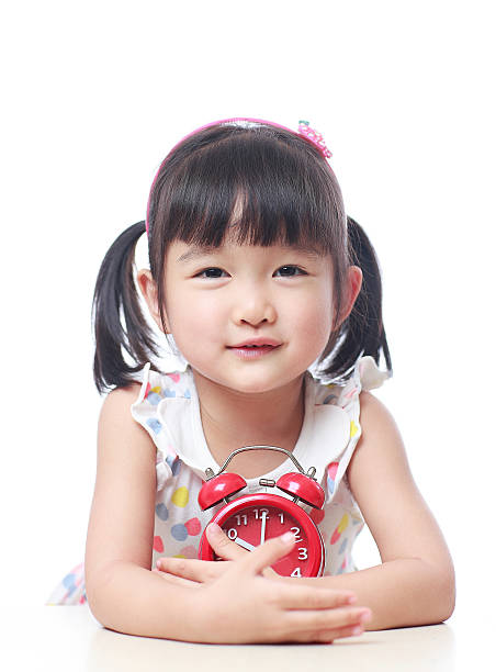 istock Children and red alarm clock 523388572
