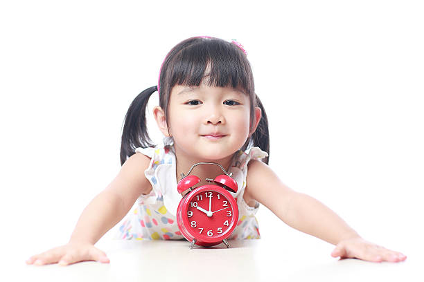 istock Children and red alarm clock 523388642