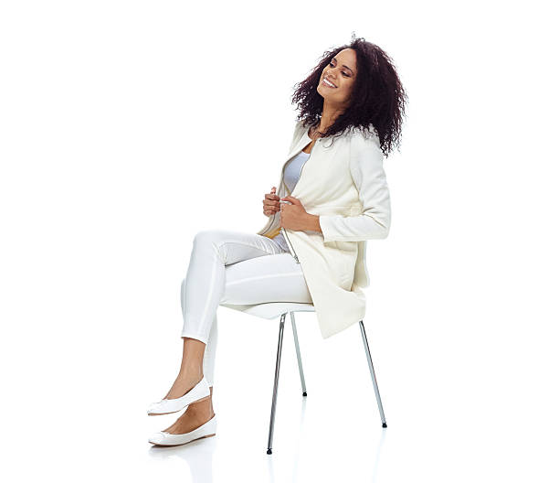 istock Cheerful woman sitting and looking away 523389118