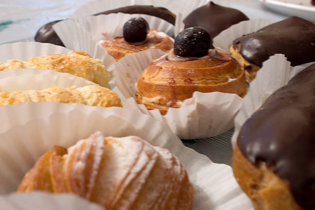 istock Eclairs and sweets filled with custard and cream 523390456