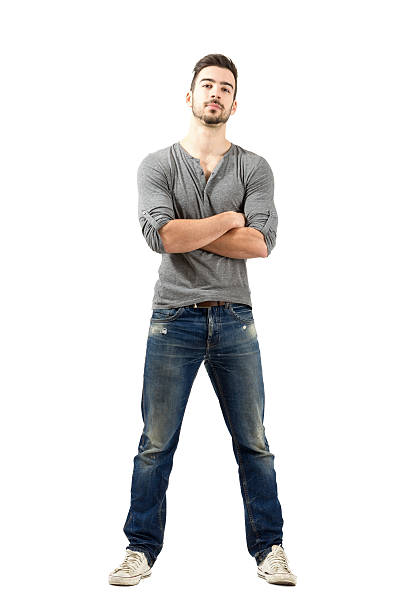 istock Young proud satisfied man with crossed arms looking at camera 523390601