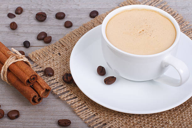 istock coffee with cinnamon in a napkin on burlap background wooden 523391303