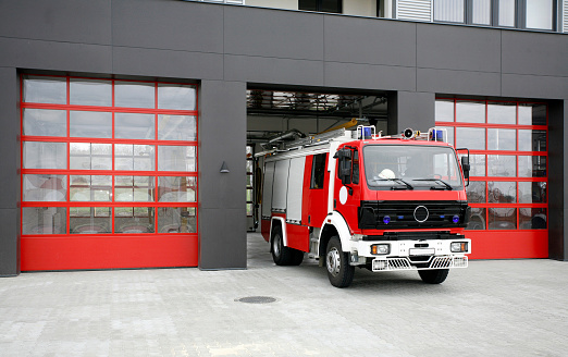 Fire-fighting vehicle near fire-station