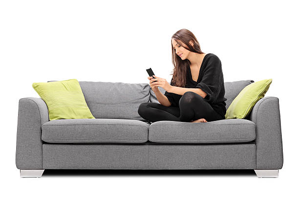 Young woman playing on her cell phone