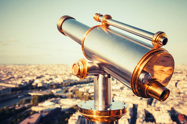 istock Metal telescope on Eiffel Tower, Paris. Retro stylized photo 523392961