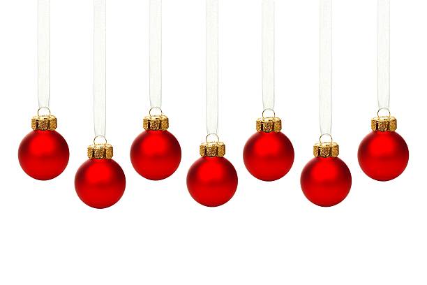 istock Hanging red Christmas ornaments isolated 523393117