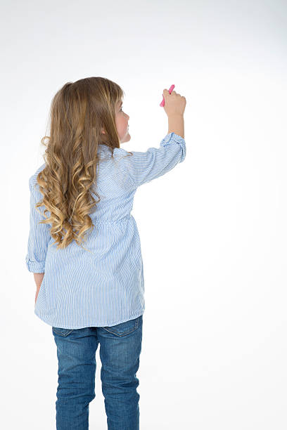 istock blond and young child from behind 523393689