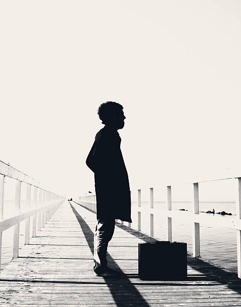 istock man on the pier ,abstract landscape, 523393715