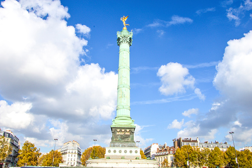Paris, France — September 18, 2022: This statue was given to France to commemorate the centennial of the French Revolution. The quarter scale replica sits on the end of Ile aux Cygnes, and artificial island built in 1827 in the Seine river.