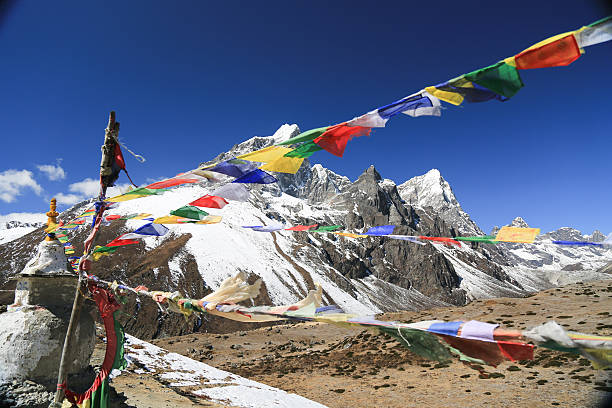 istock tabuche trekker with psalm on buddhism flag from nepal 523394633