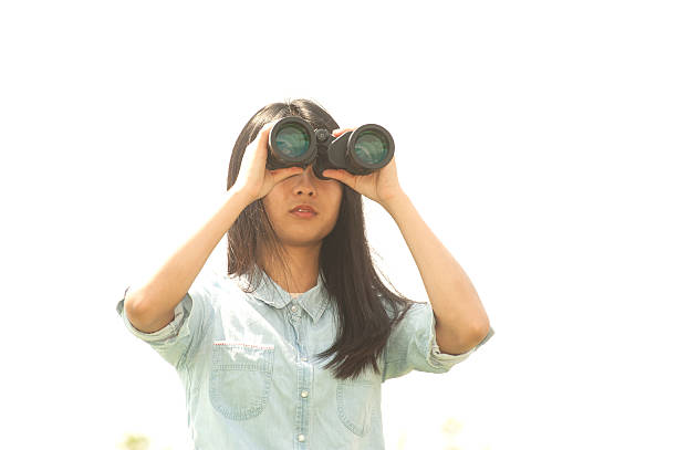 istock Young  woman seeking Binoculars . 523395150