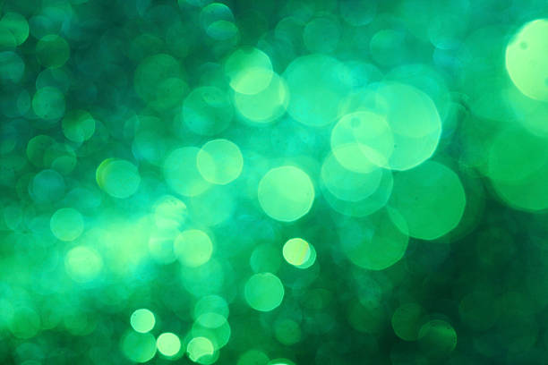 istock Dark green bokeh abstract background caused by spray water. 523395850