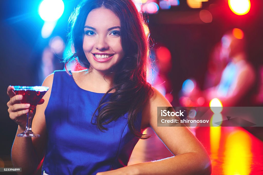 Glamorous girl Pretty young girl with martini looking at camera by the bar counter Adult Stock Photo