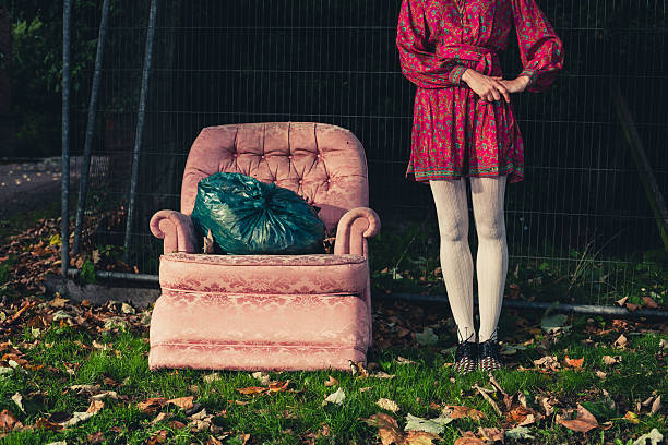 istock Woman standing by chair outside 523396911