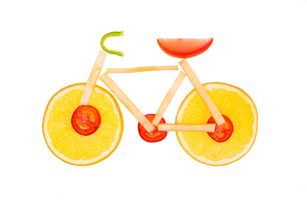 istock Bicycle shaped the from oranges, tomatoes and apples 523397429