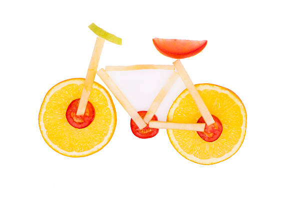 istock Bicycle shaped the from oranges, tomatoes and apples 523397497