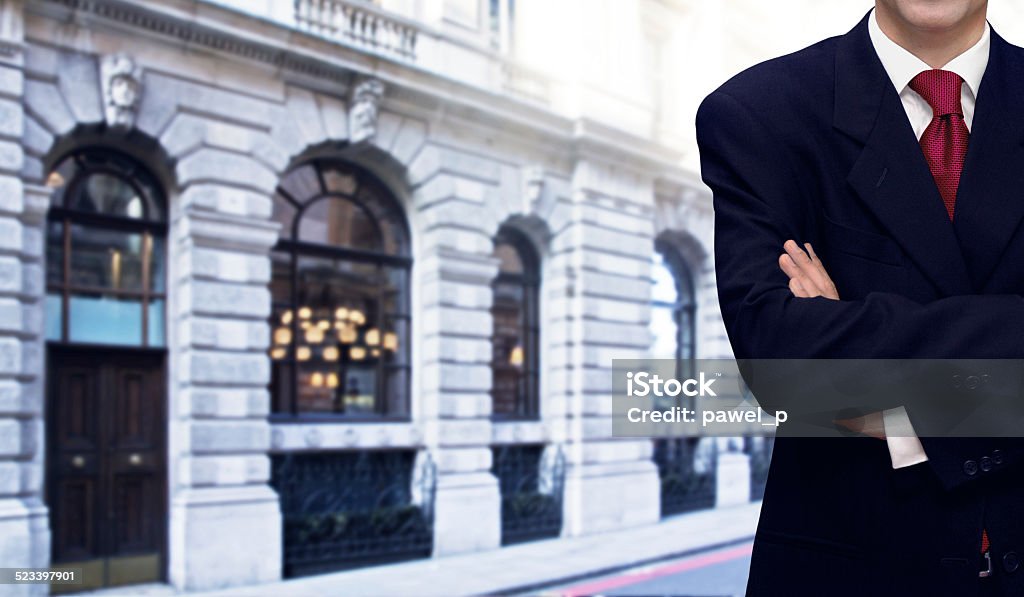 Businessman and bank office building Confident businessman and bank office building in background Adult Stock Photo