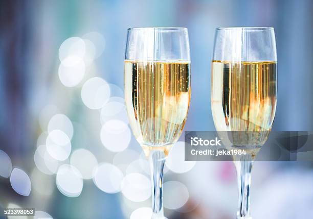 Two Champagne Glass On Christmas Bokeh Background Stock Photo - Download Image Now - Champagne, Champagne Flute, Valentine Card