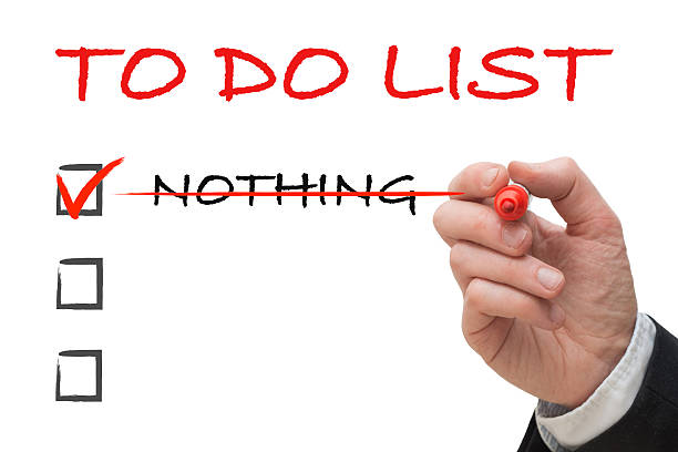 istock Hand of office worker ticking off to do list 523401048