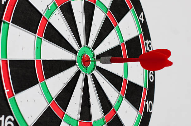 istock Darts in center of target 523403326