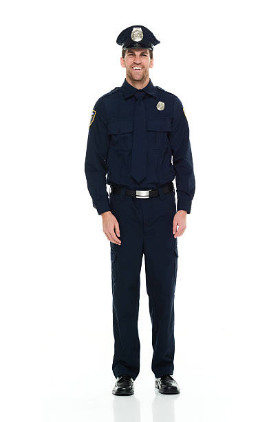 istock Smiling police standing and looking at camera 523406824