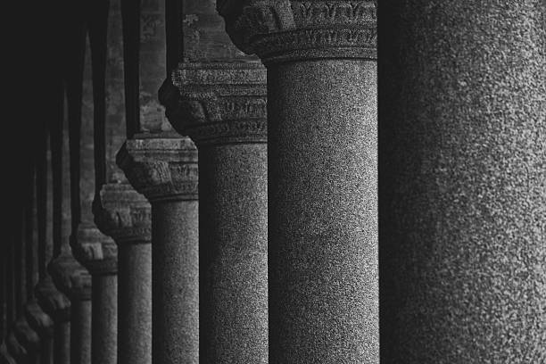 A long row of pillars in black and white. Stockholm city hall.
