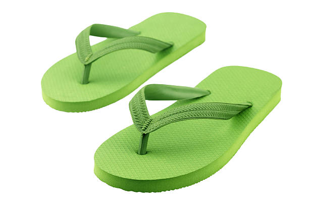 istock Green flip flop isolated on white background 523407134