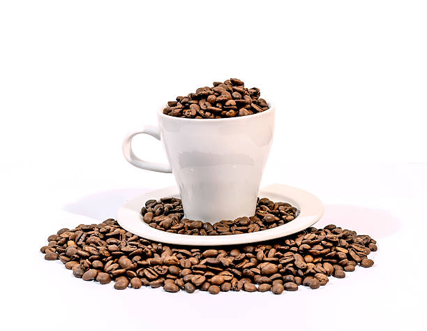 istock Coffee beans in a white coffee cup on a white 523407202