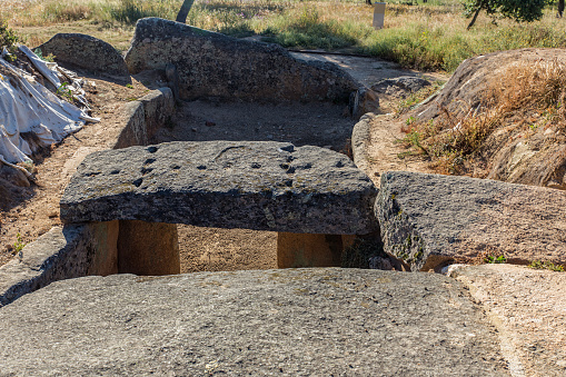 Paulilatino, Italy - October 1, 2023: A woman descending into the sacred well of Santa Cristina, a 25th century BC construction and nuragic site.