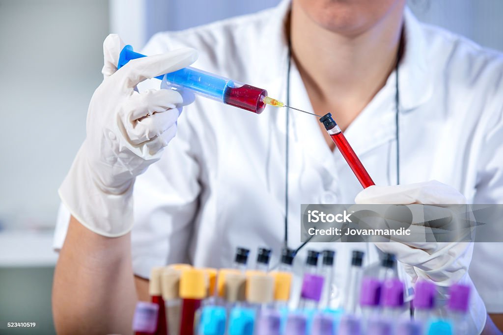 Scientist working in laboratory Scientist working with blood samples in laboratory Blood Donation Stock Photo