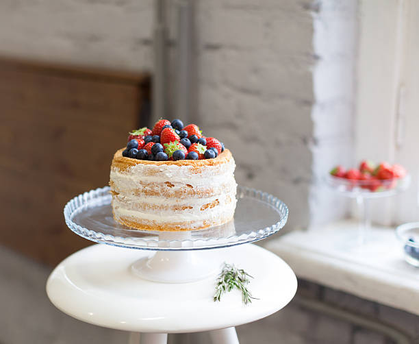 istock Beautiful biscuit cake with white cream decorated 523412891